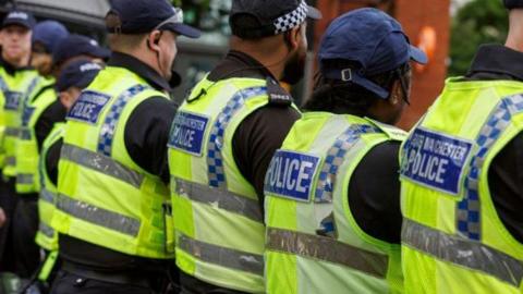 Greater Manchester Police officers form a row amid rioting and disorder following the Southport stab attack.