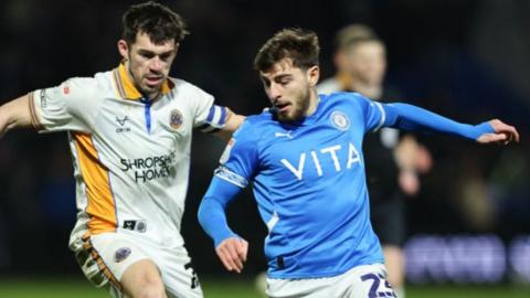 John Marquis of Shrewsbury Town and Ryan Rydel of Stockport County 