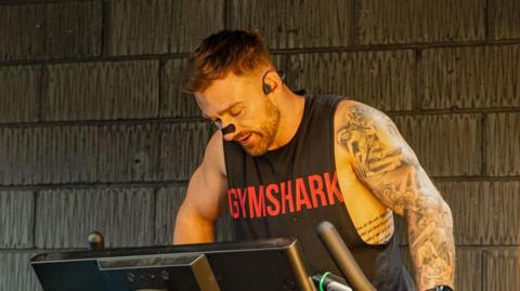 Luke during his challenge, looking focused but tired.