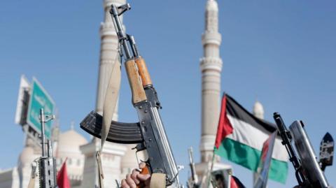 Yemen's Houthi followers brandish weapons and chant slogans 