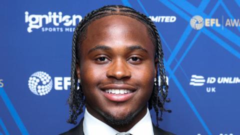 Sheldon Kendall, of Millwall, smiling while wearing a suit before an awards dinner
