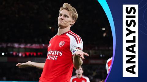 Arsenal's Martin Odegaard shrugs in celebration