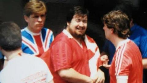A dated picture of football fans, showing Dubberley in the centre, smiling