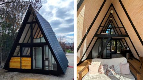 Two photos of the inside and outside of one of the cabins. The cabin, shaped like a triangle, is made of timber with a metal roof and dark grey aluminium windows and doors. Inside a white sofa can be seen with cushions on top of it. Behind the sofa is a small kitchen and a bed on the second floor of the cabin.
