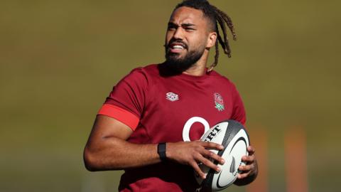 Chandler Cunningham-South carries a ball during an England training session