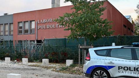 Forensic police investigate the damaged fence after the explosive robbery and attack on the POURQUERY Laboratories specialised in precious metals and gold in Lyon in France, 30 October 2025