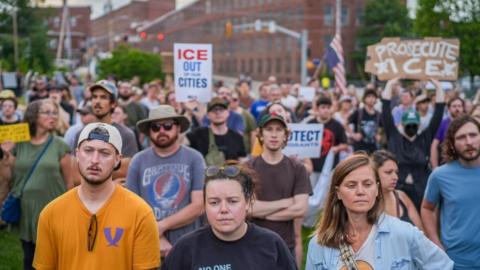 Anti-ICE protesters attend a vigil for a man that was killed in a shooting involving US Immigration and Customs Enforcement.