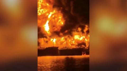 A fuel tanker burns after it appears to have been attacked in Iraqi waters