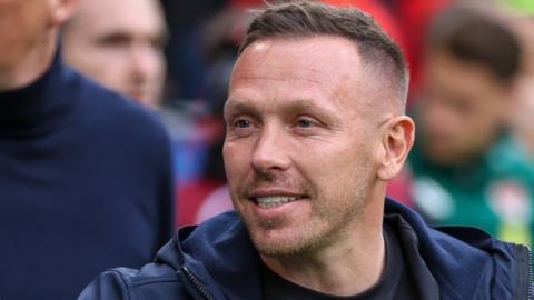 Craig Bellamy breaks into a smile