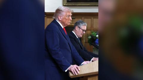 A side-on shot of Donald Trump and Keir Starmer standing side by side.