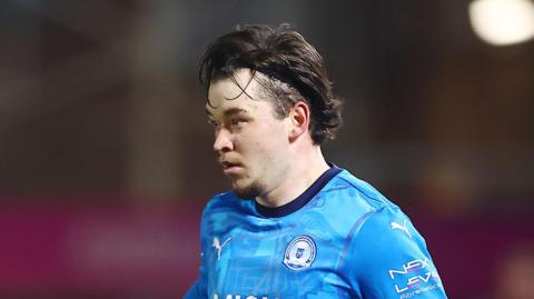 Chris Conn-Clarke playing for Peterborough last season
