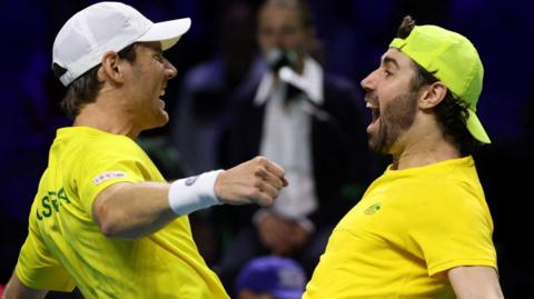 Matthew Ebden and Jordan Thompson celebrate victory at the Davis Cup