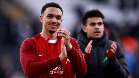 Trent Alexander-Arnold applauds Liverpool's fans after the win at Fulham