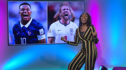 hanequa in the studio with Kane and Mbappe in the screen