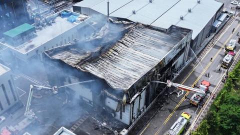 Firefighters try to put out a fire at a primary lithium battery factory in Hwaseong, South Korea, 24 June 2024