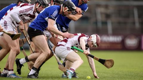 Slaughtneil's Finn McEldowney battles to win possession in Newbridge