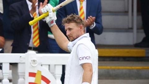 England's Joe Root holds his bat aloft