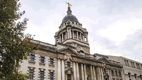 The Old Bailey exterior. It's a grand-looking stone building but rows of pillars at the front and a domed tower on top.