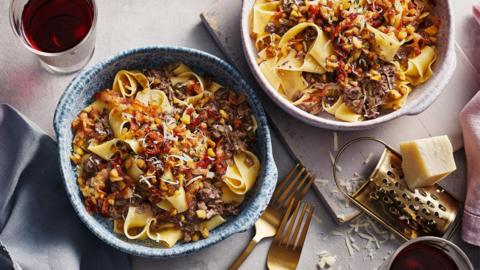 Two bowls filled with duck parppadelle. 