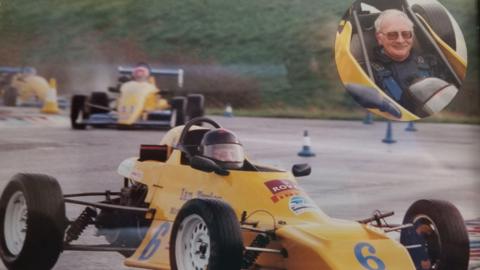 Man driving a racing car