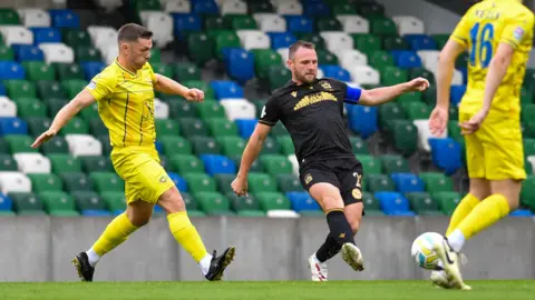 Jamie Mulgrew in action for Linfield
