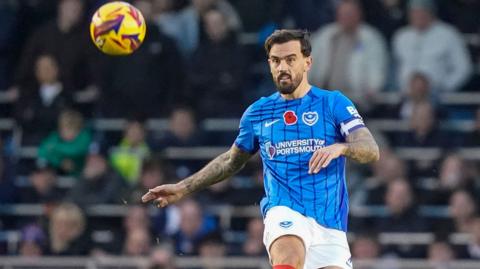 Portsmouth midfielder Marlon Pack plays a pass forward