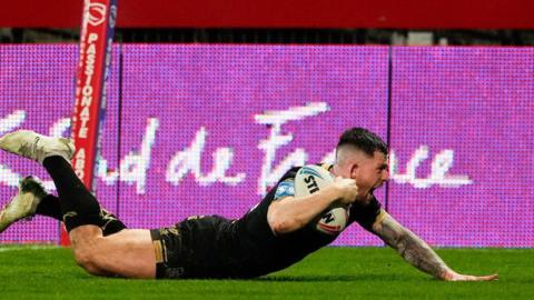 Hull FC's Cade Cust dives over to score his first try of the night