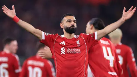 Mo Salah celebrates scoring