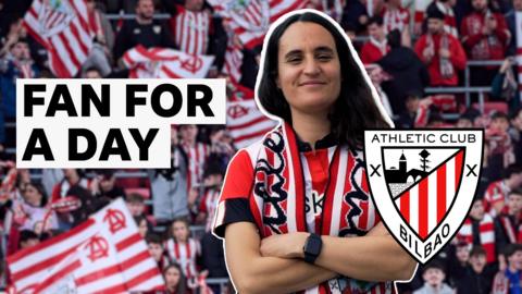 Athletic Club fan with club's badge stands with her arms crossed