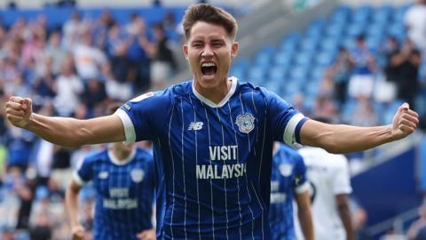 Rubin Colwill with his hands up to celebrate a goal