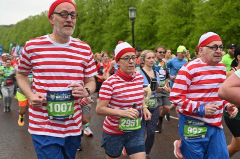 Runners dressed as Where's Wally run