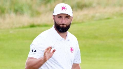 Jon Rahm waves
