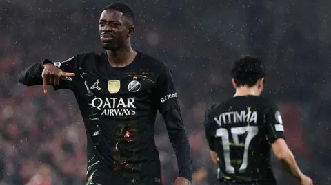 Liverpool bus arrives amid red flare smoke