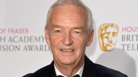 Jon Snow in a black jacket and bow tie at the Bafta Awards