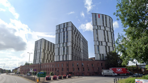 Paradise Student Village with three individual blocks of flats protruding from a three-storey brick building 