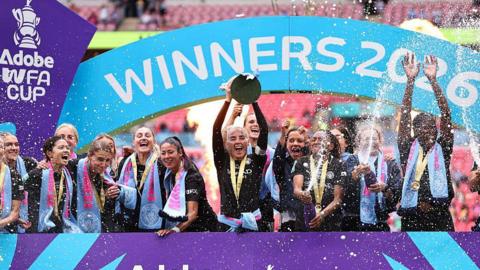Alex Greenwood lifts the FA Cup