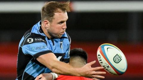 Ioan Lloyd releases the ball as he is tackled