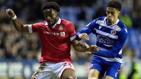 Seb Revan battles for the ball with Reading's Harvey Knibbs in March 2025