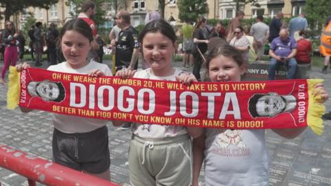 young fans with Liverpool scarf