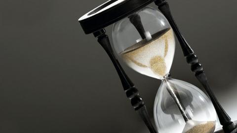 An hourglass is shown at an angle.