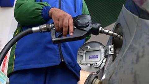 Man filling up car with fuel 