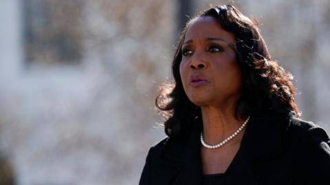 Federal Reserve Governor Lisa Cook in a black suit with a pearl necklace walks outside the U.S. Supreme Court on the day that Supreme Court justices considered US President Donald Trump's effort to fire her, in Washington, D.C., U.S., January 21, 2026