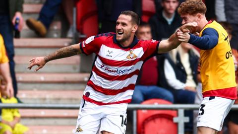 Doncaster goalscorer Billy Sharp celebrates