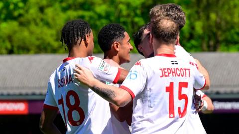 Truro City players celebrate a goal