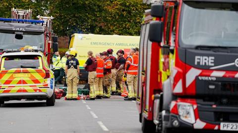 Emergency services and vehicles at the scene of an incident at Heaton Park Hebrew Congregation synagogue.