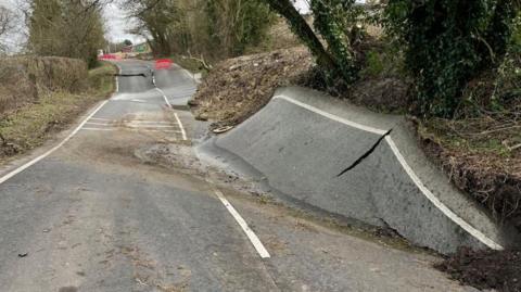 The B4069 in Wiltshire with its surface buckled