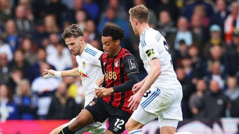 Tyler Adams is challenged by Anton Stach and Sean Longstaff