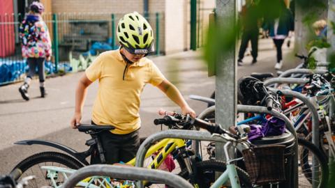 Pupil arrives at Howardian School, Cardiff on his bike.  