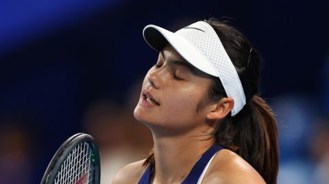 Britain's Emma Raducanu winces during her United Cup match against Greece's Maria Sakkari