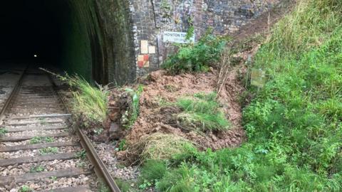 A landslip at one of the entrances of the Honiton Tunnel which left train lines blocked in Devon.